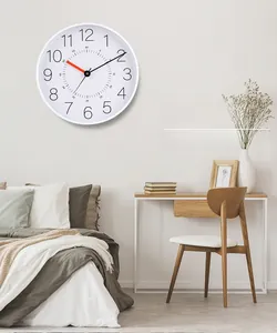 Detail of 12-inch silent plastic wall clock with 3D numbers in a minimalist bedroom