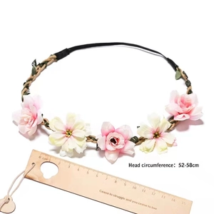 Floral headpiece detail showing 52-58cm head circumference with pink and white flowers