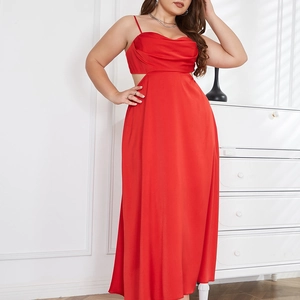 Detail of red satin maxi dress featuring an open back and elegant draped neckline