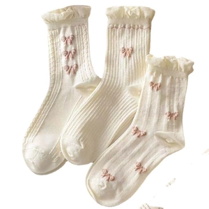 White crew socks with pink bows and ruffled edges, cute Japanese style cotton hosiery
