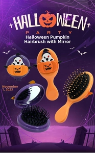 Detail of Halloween pumpkin hairbrush and foldable mirror set with massage bristles