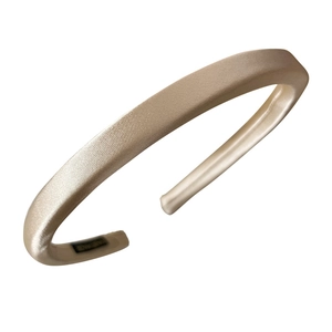Glossy champagne satin padded headband with premium silk texture and minimalist design
