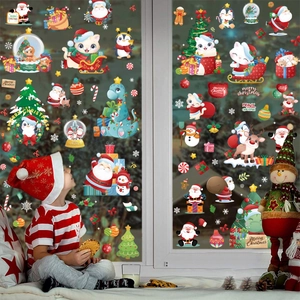 Autocollants de fenêtre de Noël avec Père Noël et renne dans une scène de fête