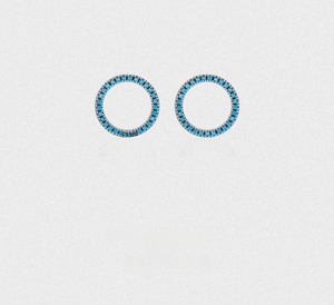 Detail of round S925 silver stud earrings featuring turquoise and pavé set small stones