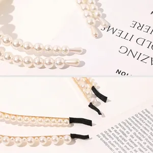Elegant pearl headband set with gold metal base and comfortable black fabric end tips