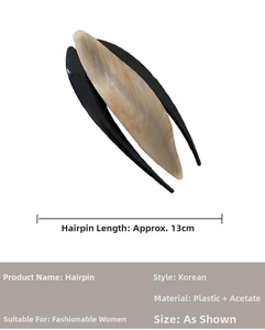 Detail showing 13cm acetate hair clip with brown marble pattern and black base