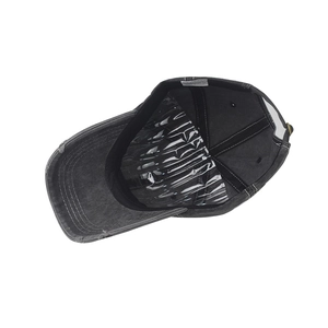 Detail view of vintage leopard baseball cap interior with sweatband and wash label