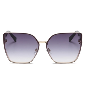 Oversized cat-eye sunglasses with gradient purple lenses and gold metal frames for women