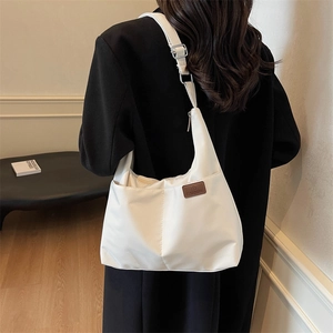 Classic white large capacity tote bag with adjustable shoulder strap for daily wear