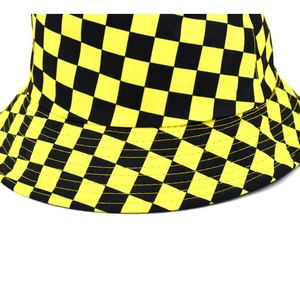 Detailed close-up of yellow and black checkerboard canvas bucket hat with stitching