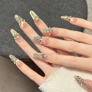 Handmade press-on nails with champagne zircons, rhinestones and pearls on gold base