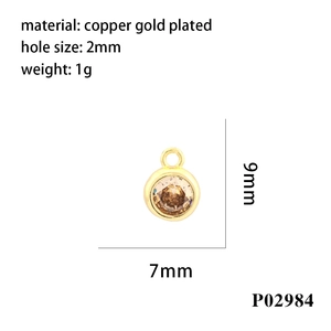 Detailed view of a gold-plated copper pendant with brown zircon and 2mm hole size