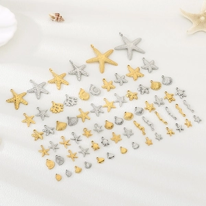 Mix of gold and silver stainless steel ocean charms like starfish, shells, and sea turtles