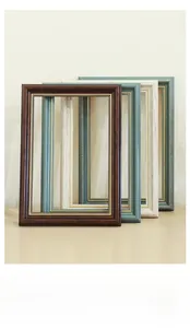 Close-up of European retro frames with golden beaded edges in multiple vintage colors