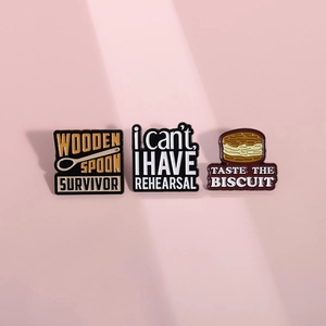 Set of three colorful enamel pins featuring cartoon hamburger design and funny typography