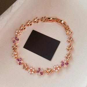 French zircon flower and pearl bracelet in rose gold with elegant floral design charms
