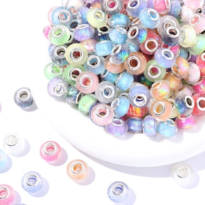 Macro shot of colorful faceted resin beads with metallic core for DIY jewelry making
