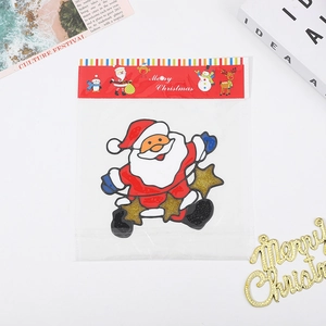 Christmas Santa Claus window sticker with gold glitter stars in festive gift packaging