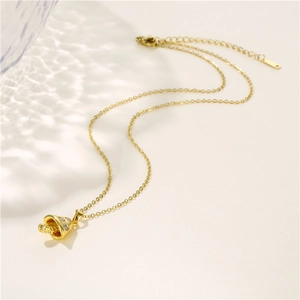 Gold mushroom pendant necklace with sparkling cubic zirconia on a minimalist cable chain