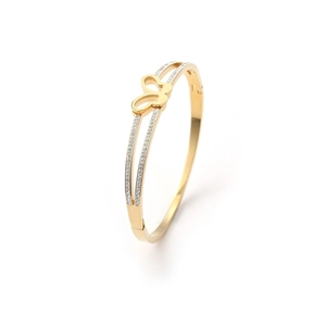 Close-up of a gold butterfly bangle with hollow design and sparkling diamond accents