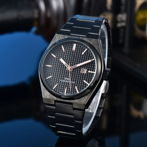 Detailed macro view of the black waffle texture dial and rose gold hands on the PRX watch