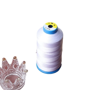 White DIY beading thread roll size 12 with decorative glass crown on white background