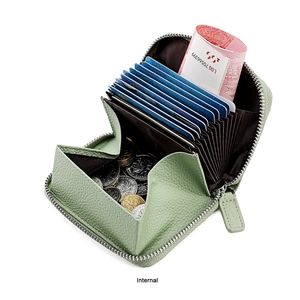 Internal view of mint green leather accordion wallet with card slots and coin pocket