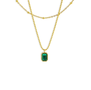 Detail of double-layer gold necklace featuring emerald cut green zircon pendant