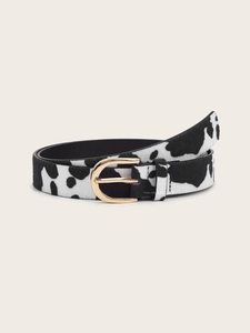 Detailed view of women's belt featuring cow print horsehair texture and gold pin buckle