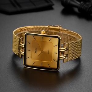 Detailed view of square gold quartz watch with a classic mesh strap and minimalist dial