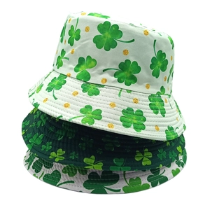 Stacked St. Patrick's Day bucket hats with green shamrock prints and gold glitter dots