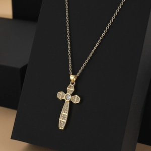 Elegant gold cross pendant necklace with cubic zirconia on a minimalist O-chain
