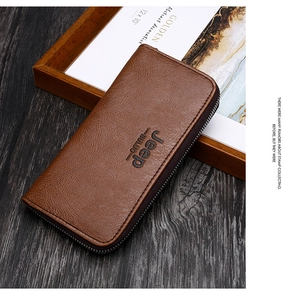 Close-up of a brown leather long wallet featuring a metal zipper and embossed logo