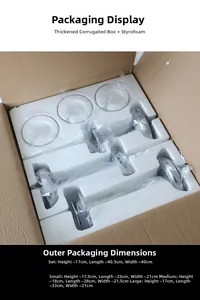 Detail view of glass candle holders with protective foam and thick cardboard packaging