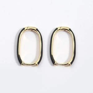 U-shaped oval gold earrings with black enamel inlay in minimalist vintage style