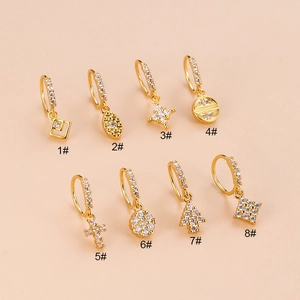 Golden nose rings with zircon cross and star pendants displayed in eight styles