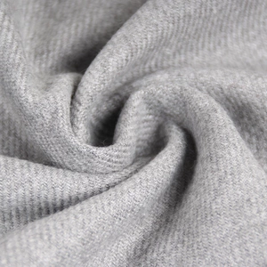 Men's minimalist gray winter scarf with thick diagonal twill weave and fringe detail