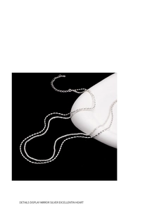 Detail shot of the S925 silver double-layer necklace with textured grain and clasp