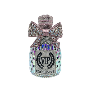 Detail of luxury crystal clutch bag with silver rhinestones and pink bow decoration