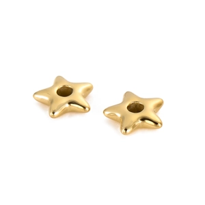 Close-up of shiny gold star-shaped DIY beads with center holes for jewelry making