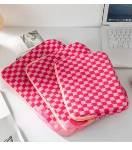 Three-piece checkered knit laptop sleeve set in red and pink with secure zippers
