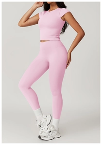 Close-up of pink high-waisted yoga pants and short sleeve top set with high elasticity