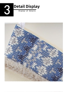 Detail showing blue knitted texture with faux fur trim and hanging rope on Christmas stocking