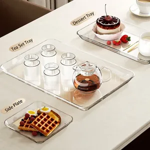 Minimalist transparent acrylic serving tray for tea sets and desserts on a stone table