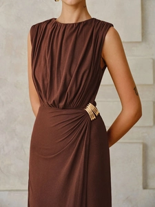 Sleeveless deep brown ruched maxi dress with gold metallic waist detail on model