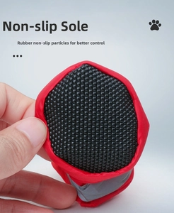 Detail of dog boots featuring non-slip rubber particles and reflective safety strips