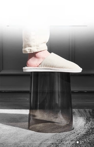 Close-up of thickened PET material on a clear grey stool showing 75kg load capacity