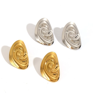 Spiral twisted stainless steel hoop earrings in gold and silver finish on white background
