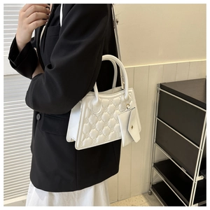 White quilted crossbody bag with designer letter patterns and matching small coin purse