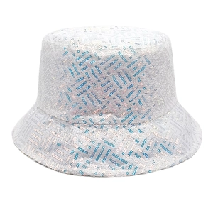 Close-up of shiny sequins on white bucket hat featuring blue and pink geometric stripes